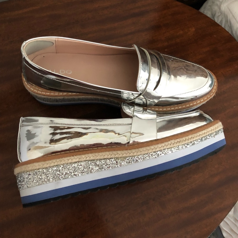 Real cool silver platform loafers.  Size 11